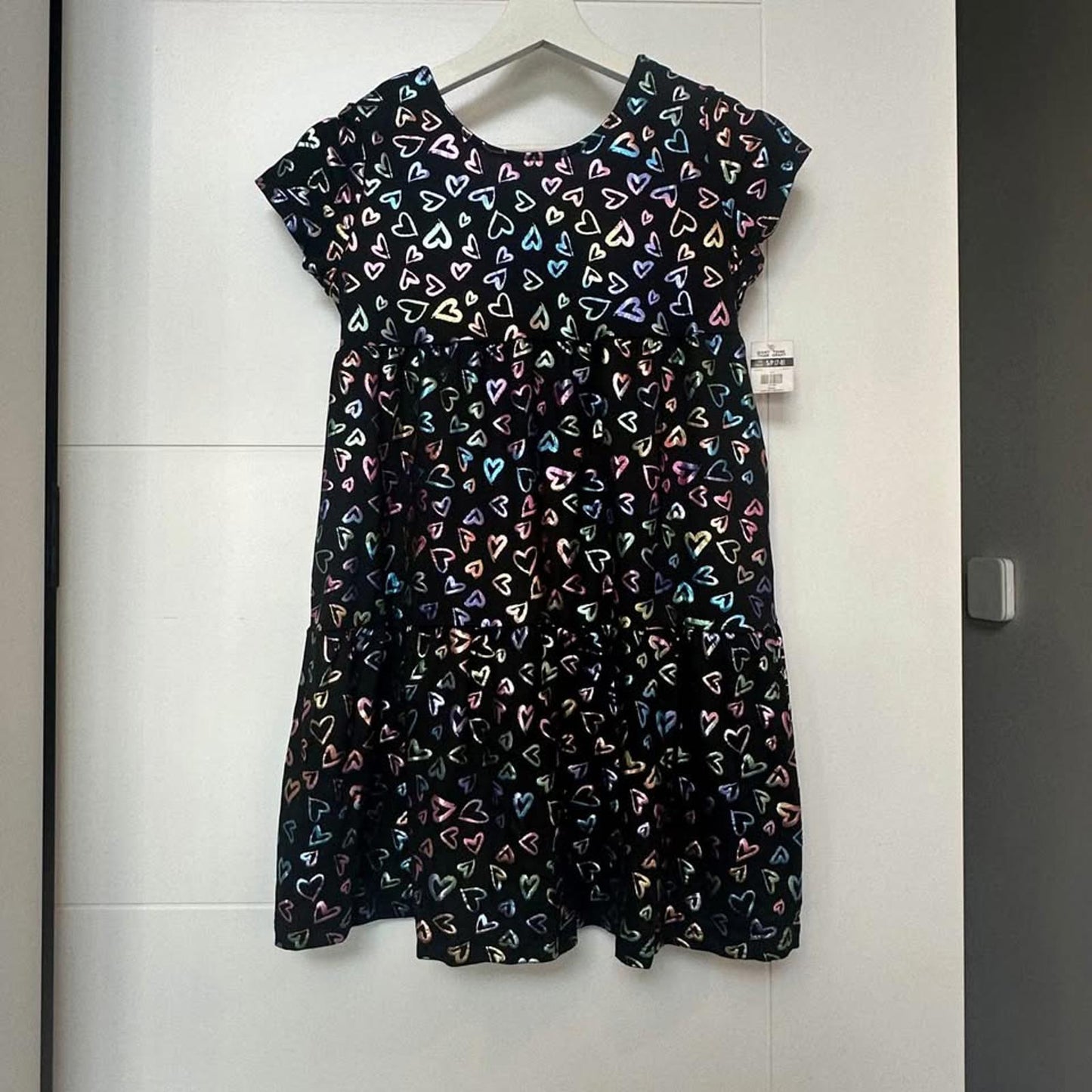 Brand new kids black dress with metallic hearts & back cut-out size Small (7/8)