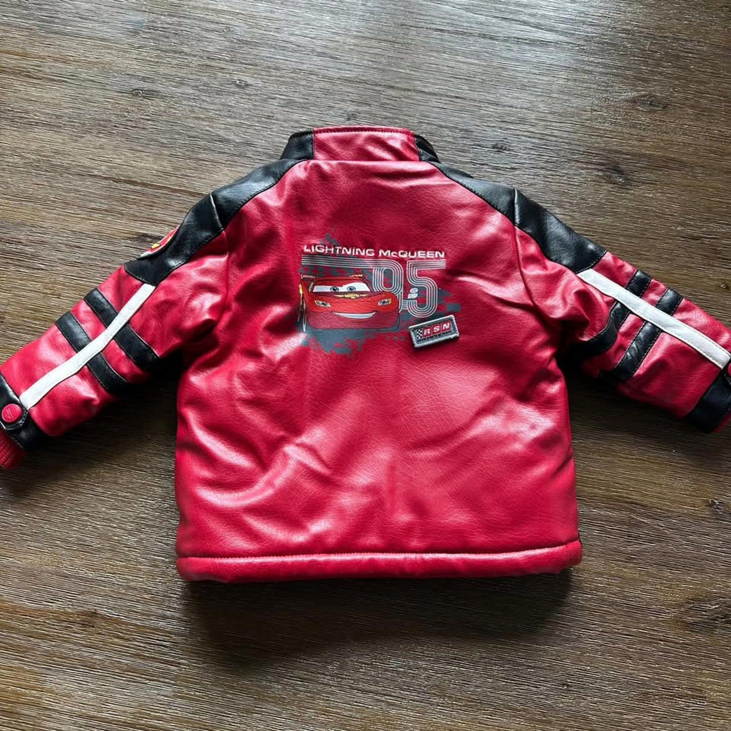 The Cars Lightning McQueen baby faux leather jacket with patches size 12 months