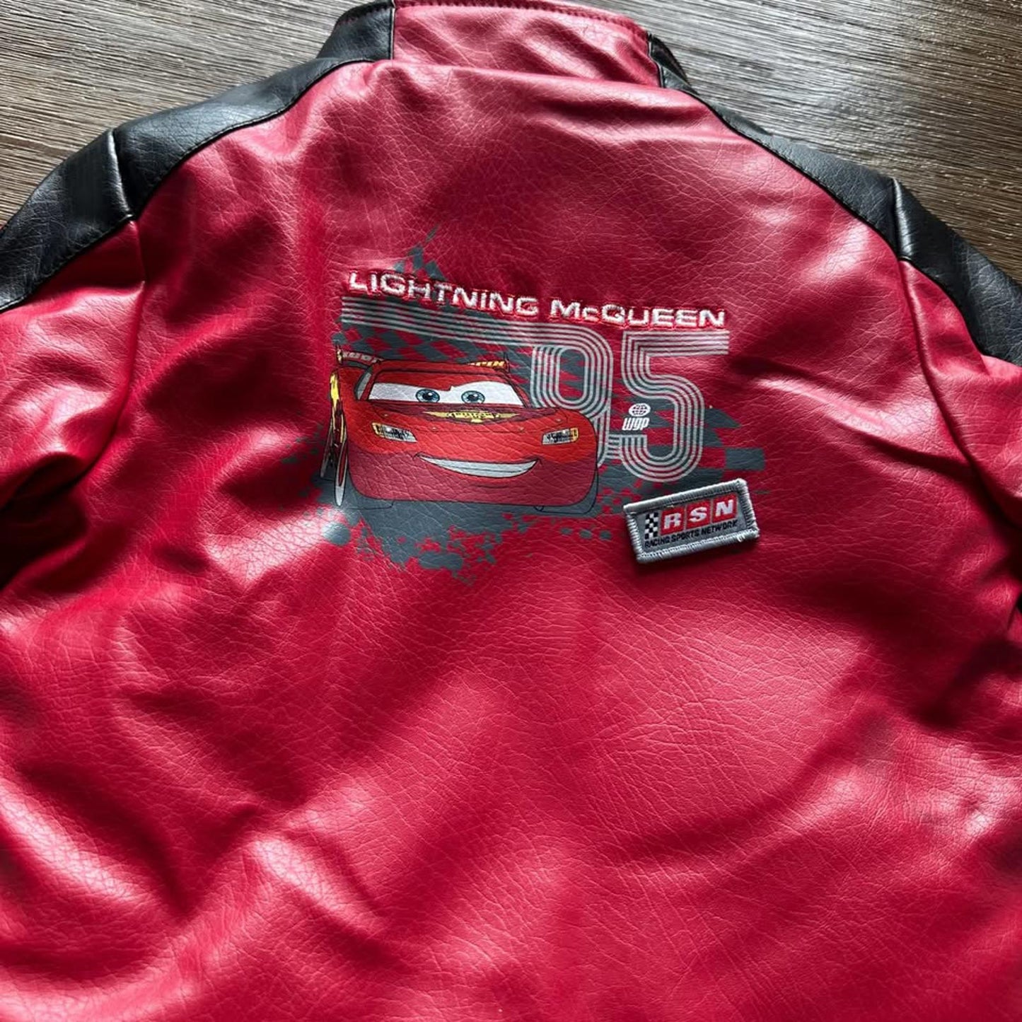 The Cars Lightning McQueen baby faux leather jacket with patches size 12 months