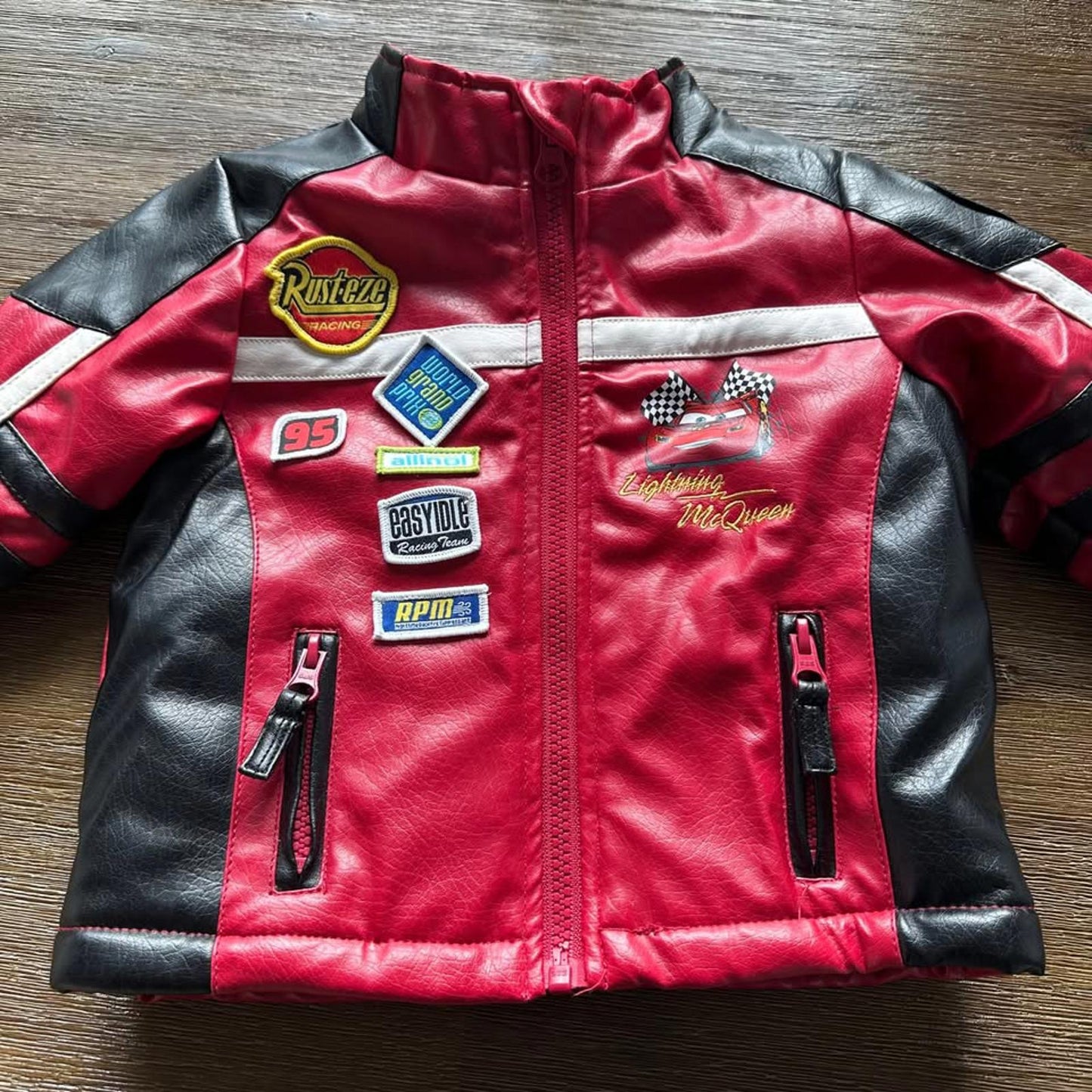 The Cars Lightning McQueen baby faux leather jacket with patches size 12 months